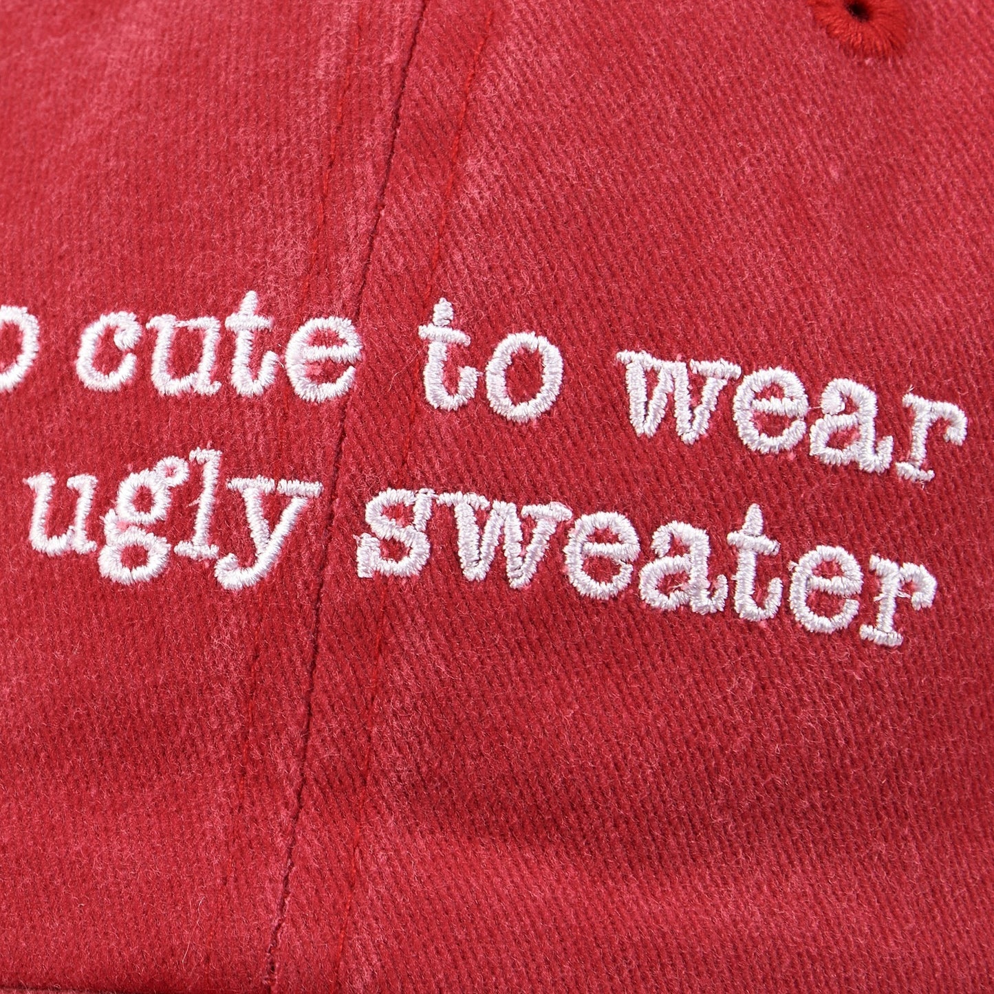 CJ Gift Goddess red washed cotton baseball cap with white embroidered text "too cute to wear an ugly sweater".