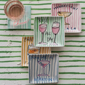 Set of decorative ceramic plates with cocktail-themed designs