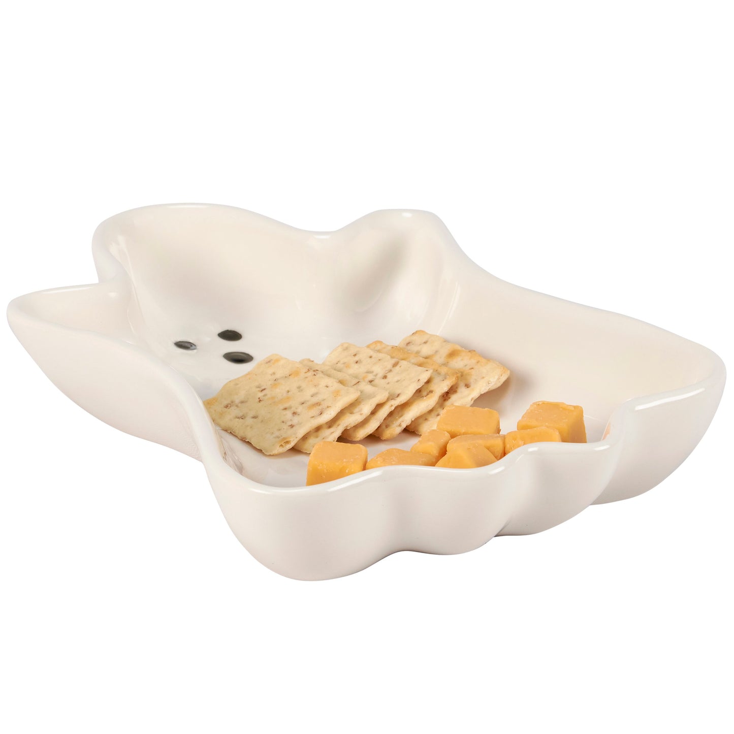 White ceramic dish with crackers and cheese on a white background