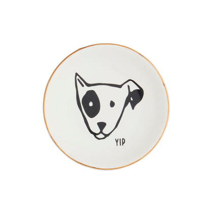 Round white plate with a black dog illustration and 'YIP' text