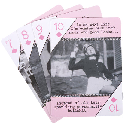 Playing cards with humorous text and black and white photo on pink backings