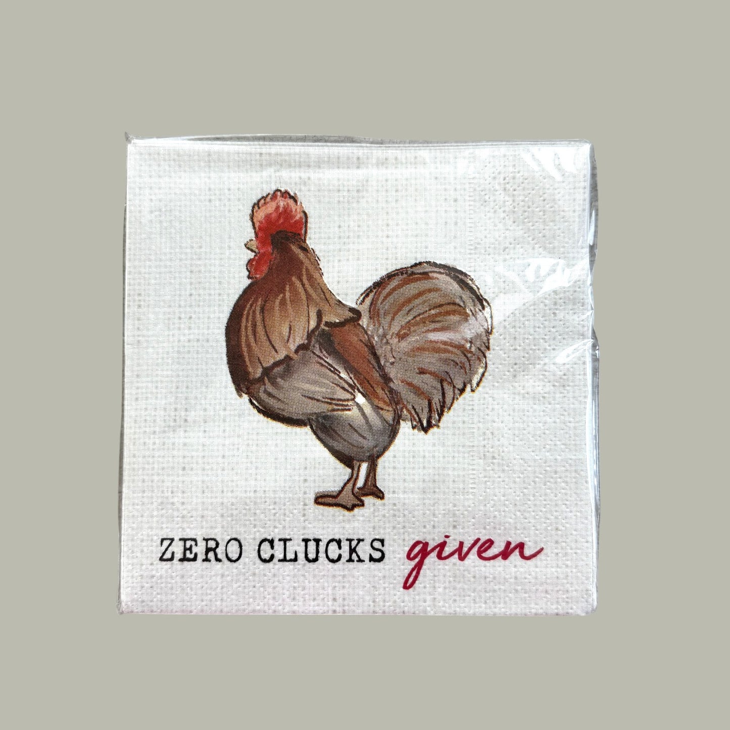Napkin with a rooster illustration and text 'Zero Clucks given' 