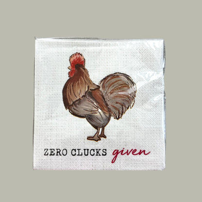 Napkin with a rooster illustration and text 'Zero Clucks given' 