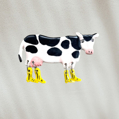 Cow-shaped wall hook with yellow boots