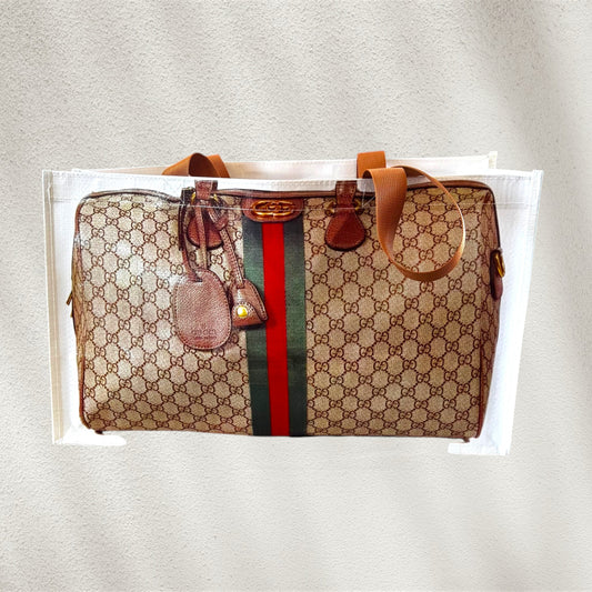 Designer looking plastic tote with Gucci pattern