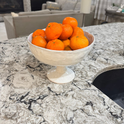 Footed  organic bowl of oranges with a glazed finish