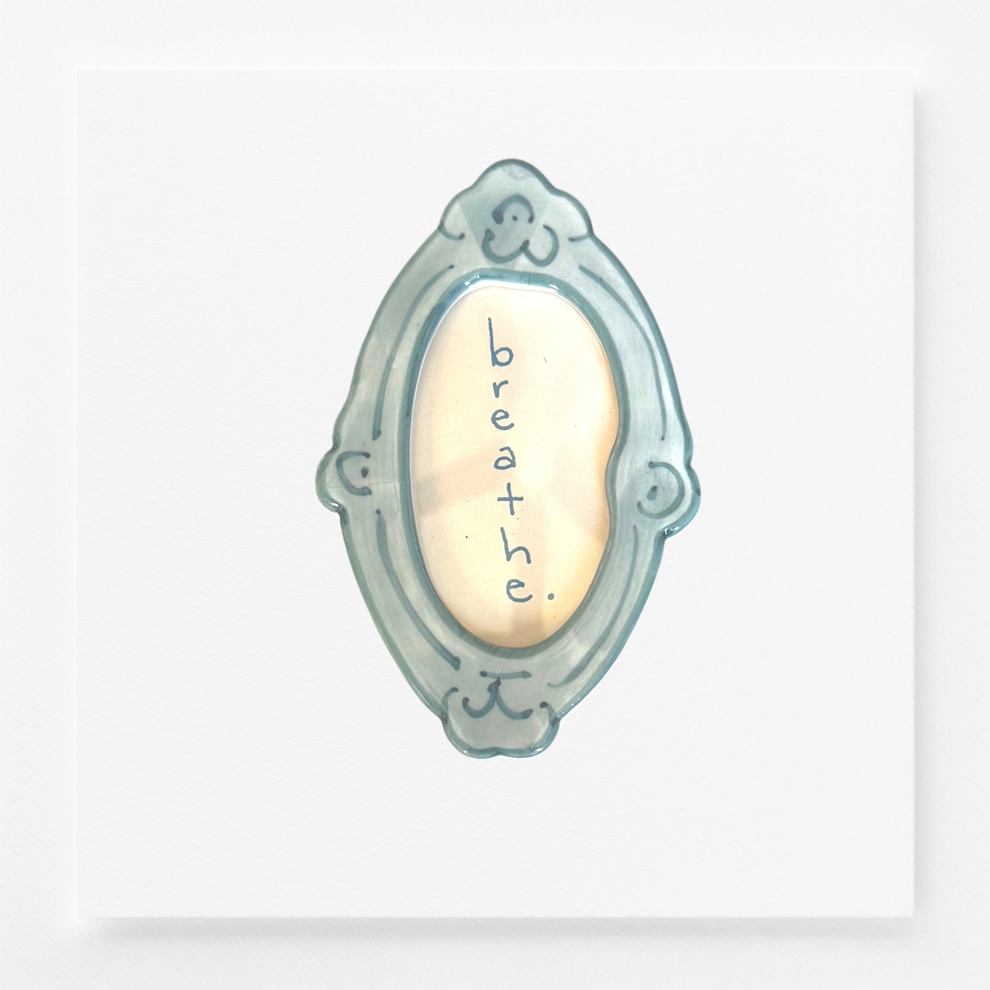 Decorative frame magnet with 'breathe' text 