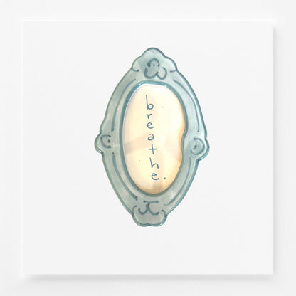Decorative frame magnet with 'breathe' text 