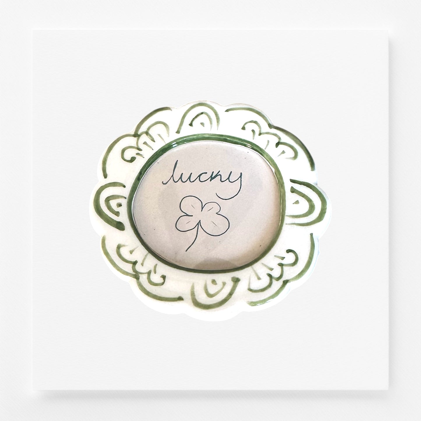 Decorative frame magnet with 'lucky' and a clover leaf design