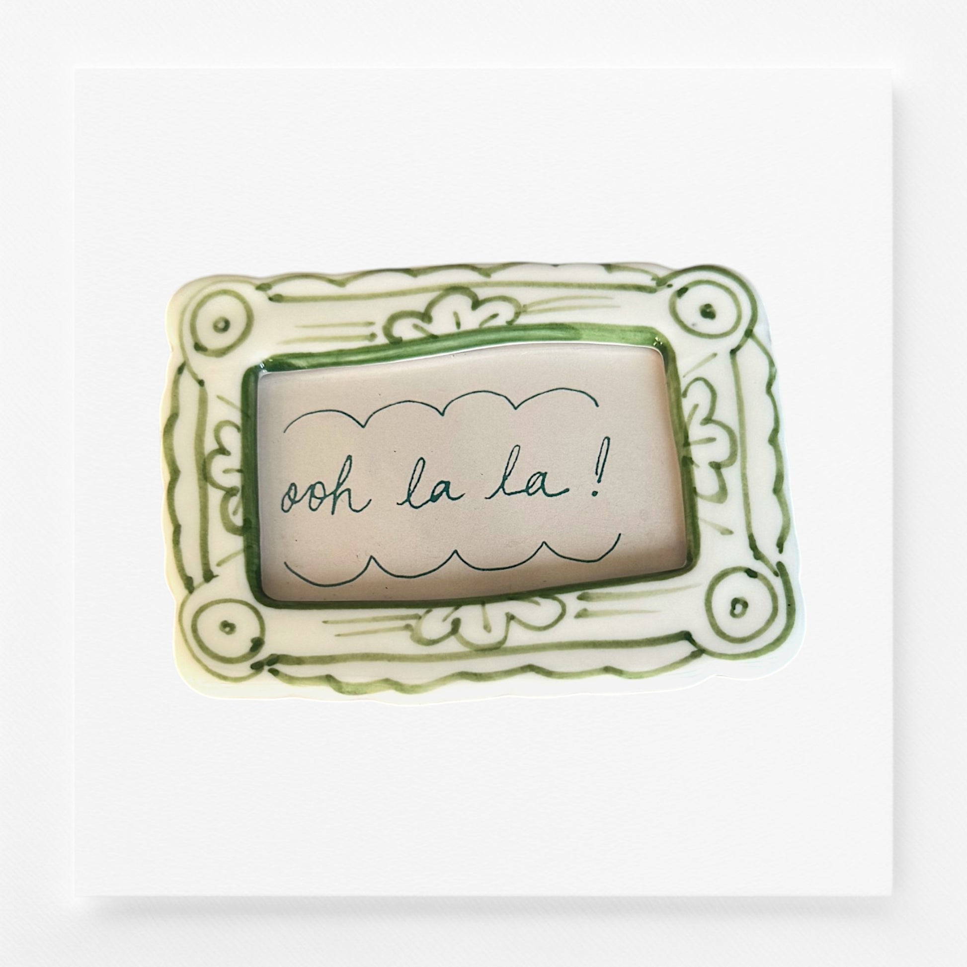 Decorative frame magnet with 'ooh la la!' text