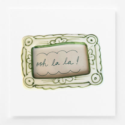 Decorative frame magnet with 'ooh la la!' text