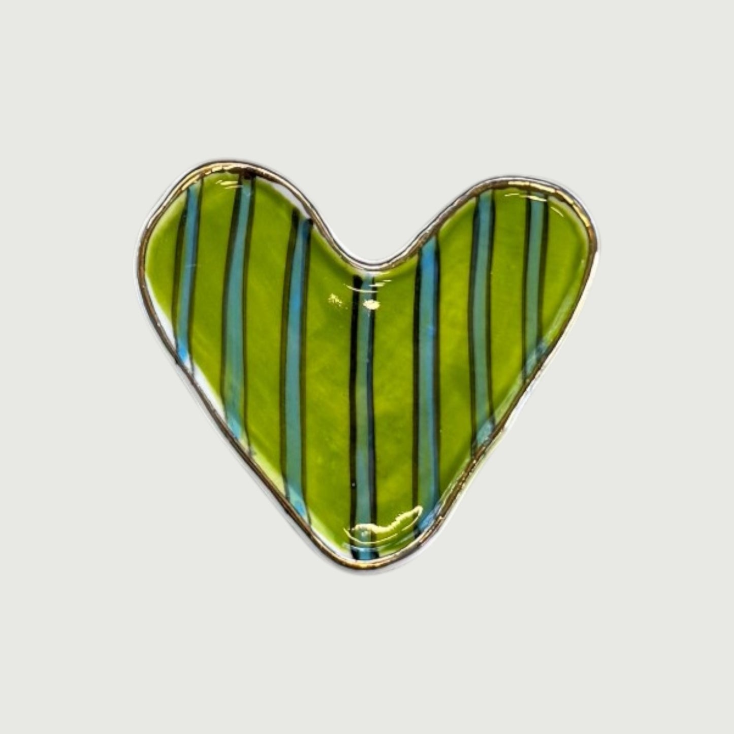Heart-shaped magnet with green and blue striped pattern 