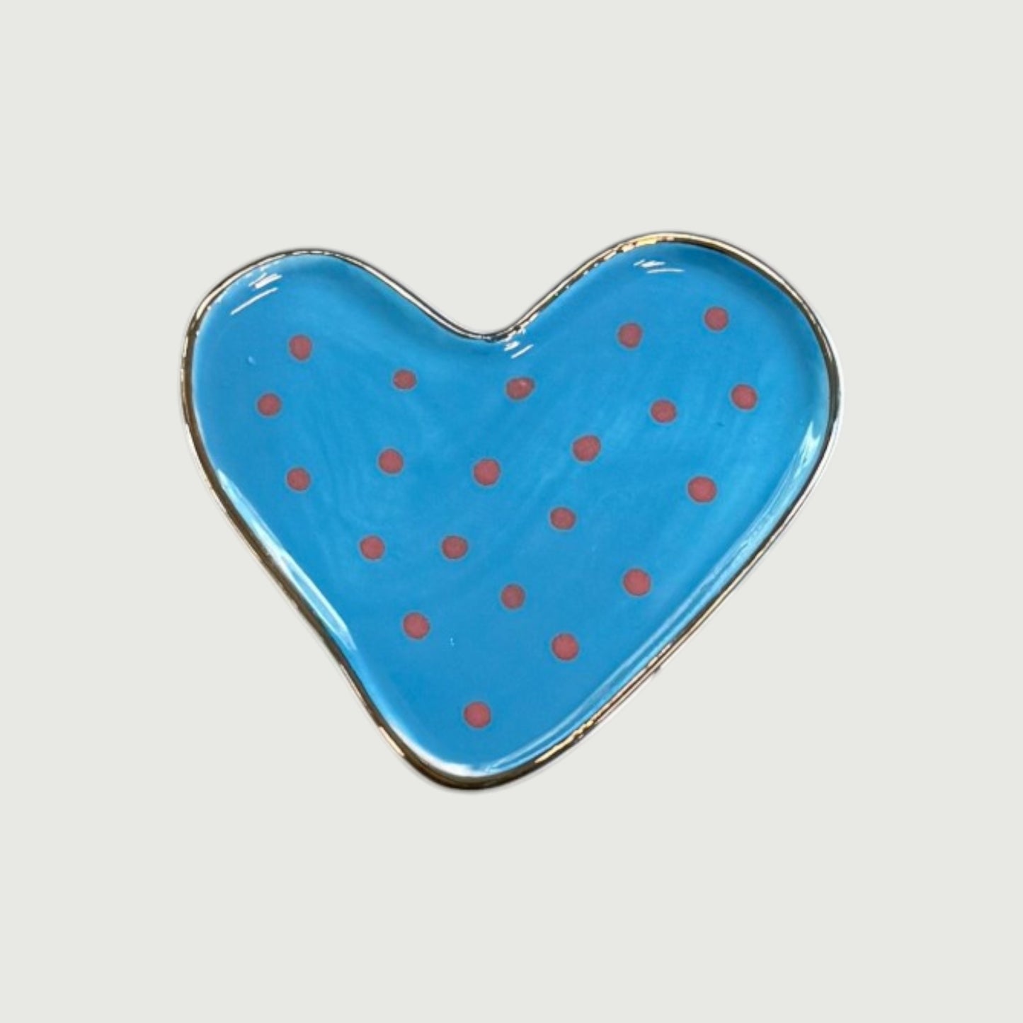 Heart-shaped blue magnet with red polka dots