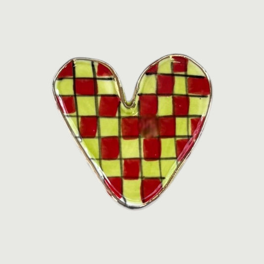 Heart-shaped magnet with a checkered pattern in red and yellow 
