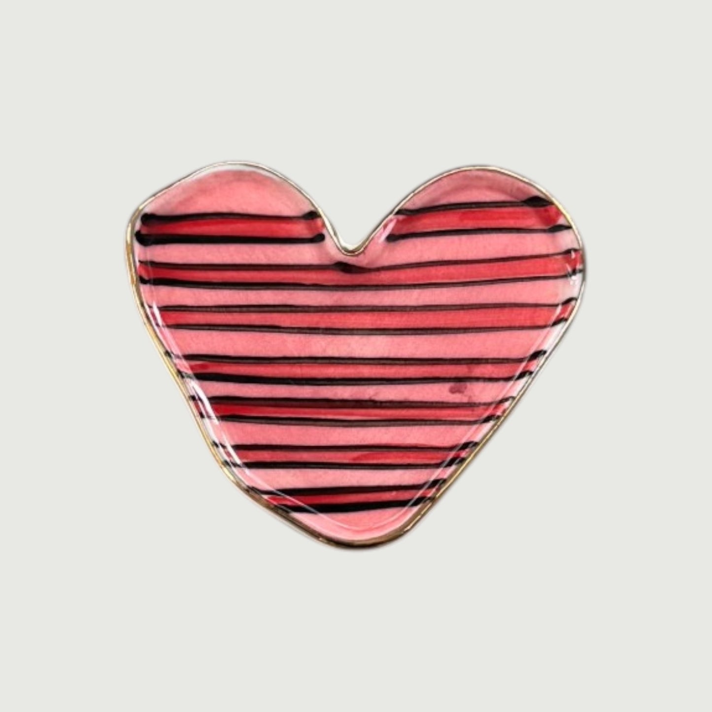 Heart-shaped magnet with pink and black striped design