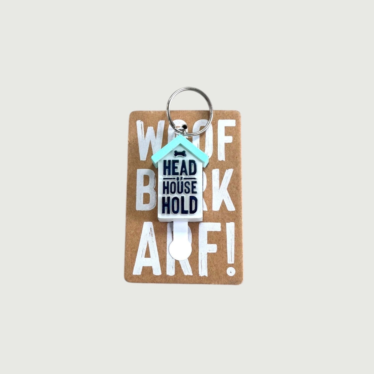 Keychain with text 'Woof, Head House Hold