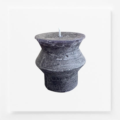 Textured grayish black textured candle