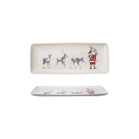 Two ceramic trays with Christmas-themed designs with Santa and reindeer