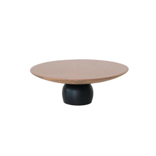 Round serving pedestal with a wooden top and black base 