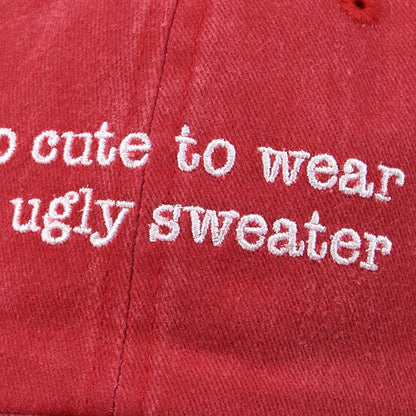 CJ Gift Goddess red washed cotton baseball cap with white embroidered text "too cute to wear an ugly sweater".
