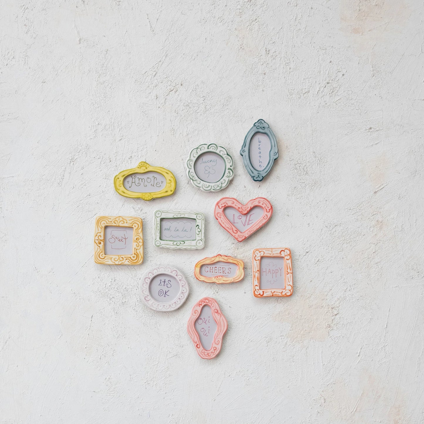 Set of small decorative frames in pastel colors