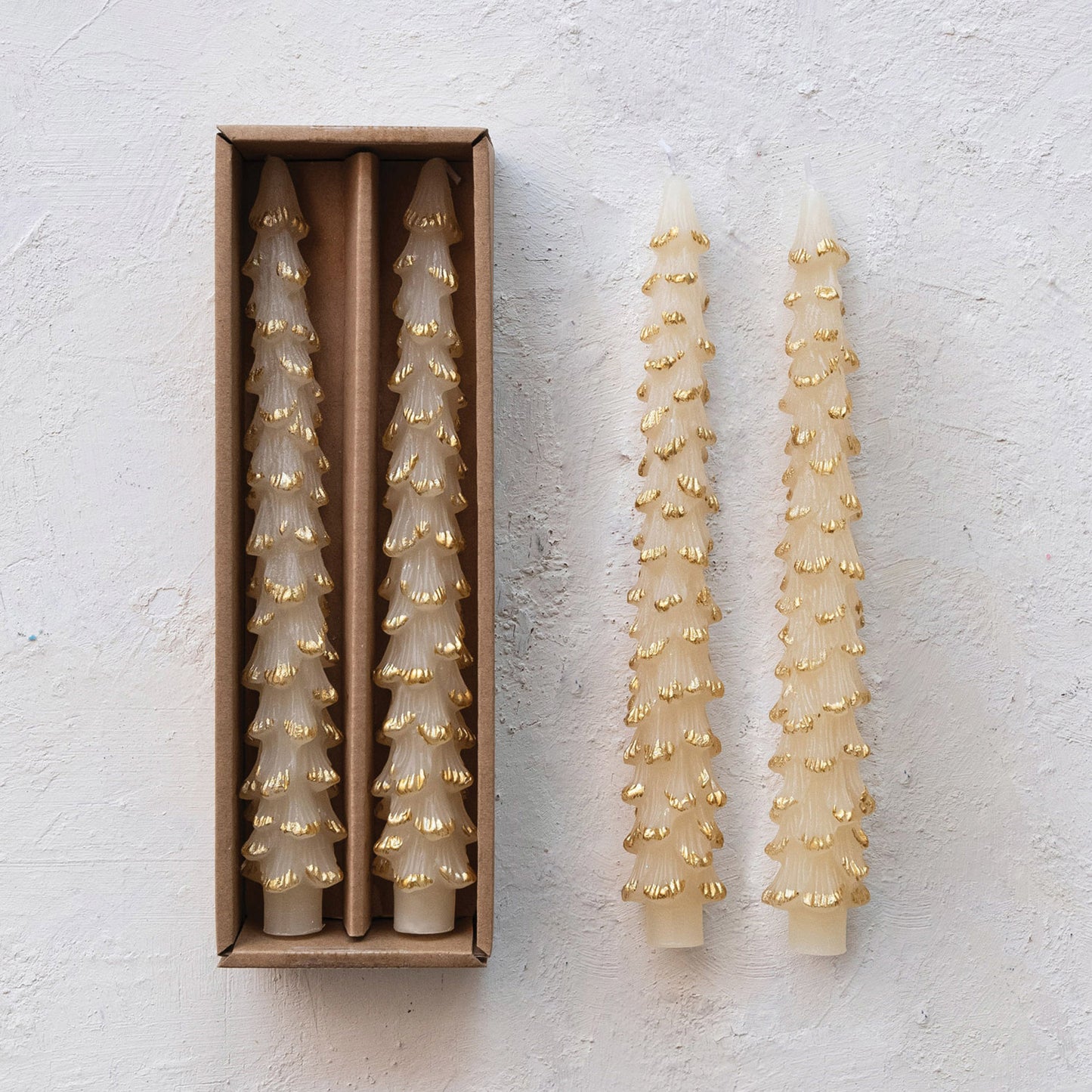 Set of 2 unscented candles in the shape of  trees.  Cream with gold accents on the tips.