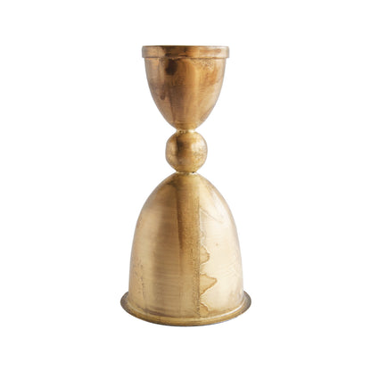 Gold metallic candle holder on a white background