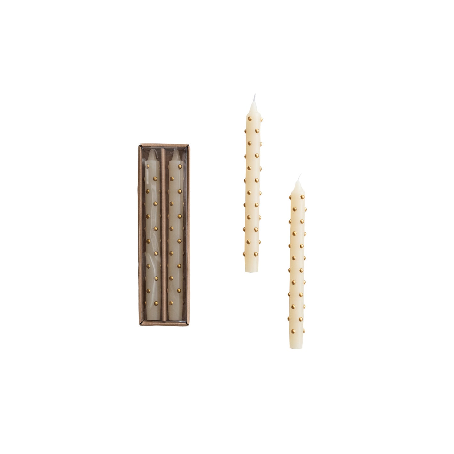 Two cream taper candles with small gold dots, shown with a decorative box